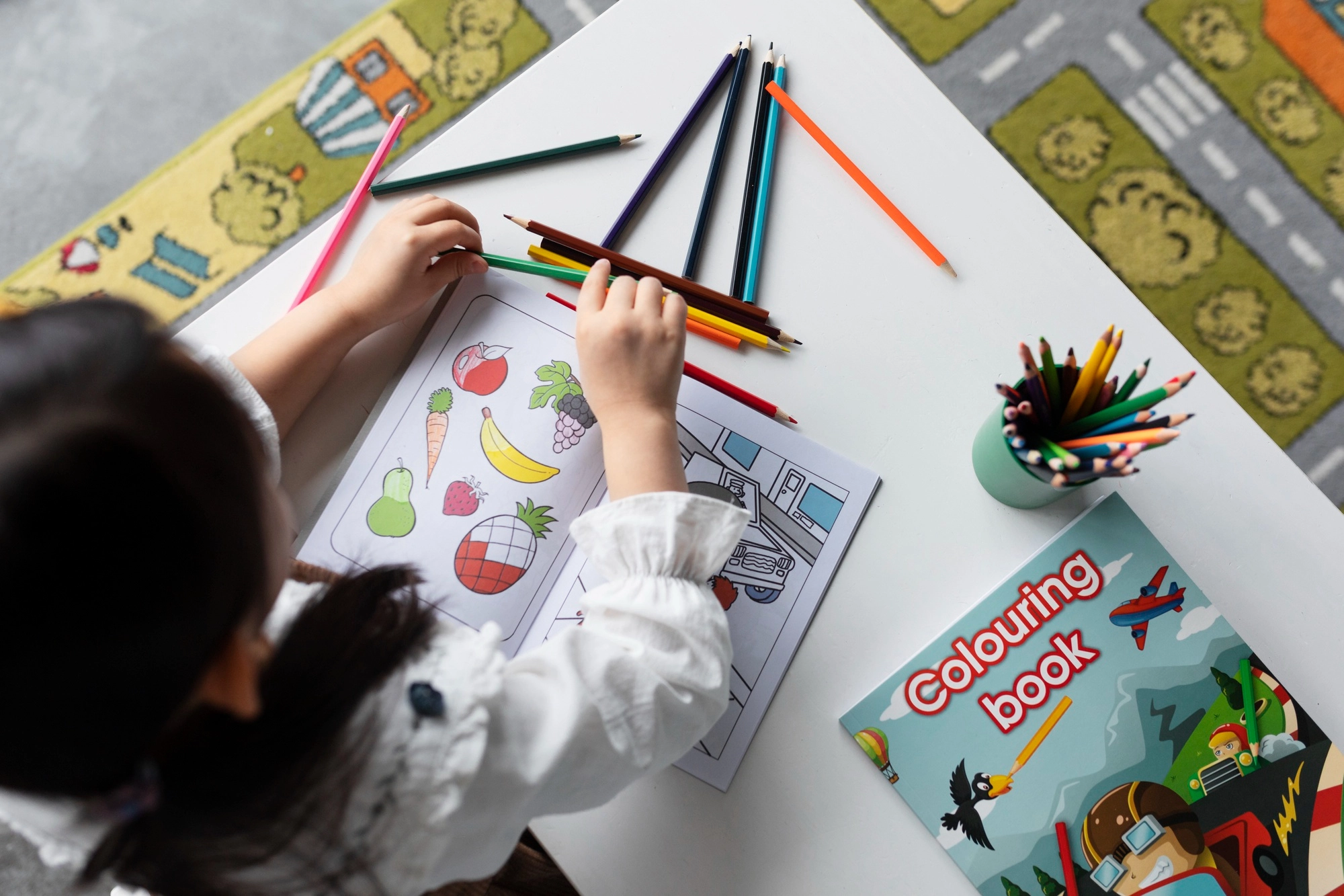 top-view-girl-with-coloring-book copy.webp