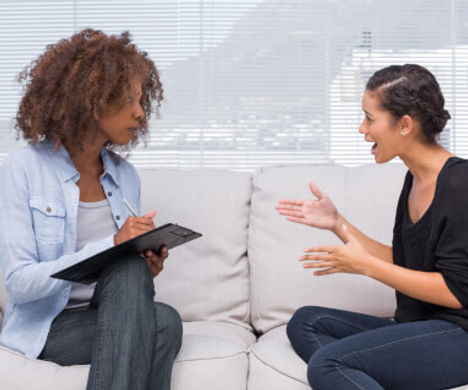 female-therapist-with-young-female-patie