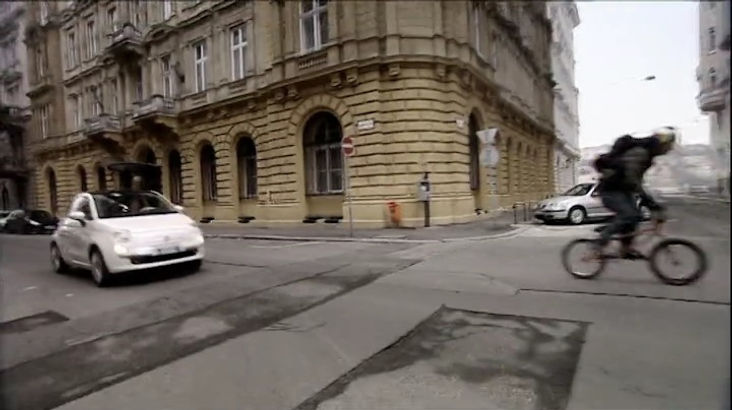 Top Gear Series 10 Episode 9 - The BMX riders and James May in the Fiat 500 pass by a building in the center of the city in Budapest, Hungary.