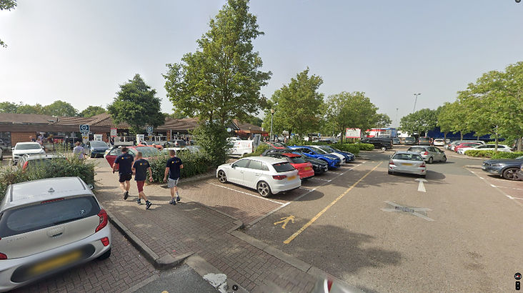 Top Gear Series 10 Episode 7 - A view of the parking lot at the motorway service area that the presenters are to meet up at with their cheap Leyland cars.