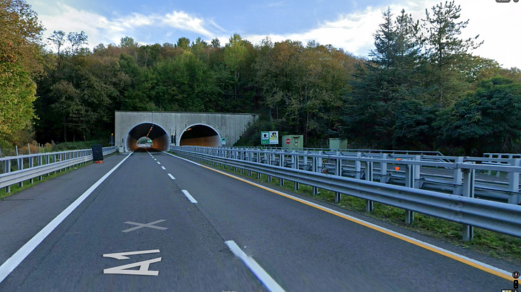 Top Gear Series 18 Episode 1 - Richard is seen exiting a motor way tunnel on the A1 as the presenters head north through Tuscany to the Imola race circuit.