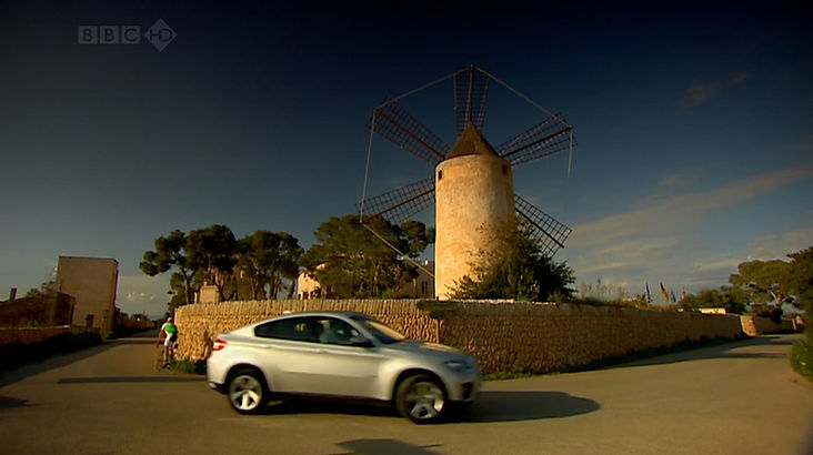 Top Gear Series 14 Episode 7 - Jeremy driving the BMW X6 past an old Spanish windmill near Llucmajor, Balearic Islands, Spain.