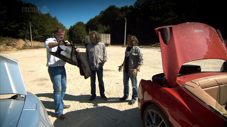 Top Gear Series 14 Episode 1 - The presenters are pulled off at a rest area on the side of the mountain road to assemble their roofs for their cars while presenting James with a gift - his very own Dacia Sandero.