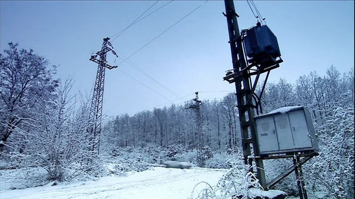 Top Gear Series 10 Episode 9 - James May driving the Fiat 500 on a snow covered back road past some old power lines near Budapest, Hungary.