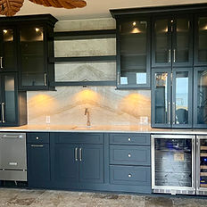 Custom black wet bar with glass upper cabinets custom floating shelves and a floating wet bar on welded custom frame