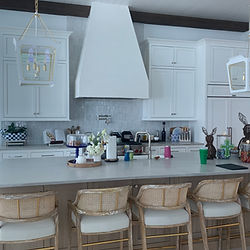 Custom inset white cabinets with custom hood built to match cabinets with white oak island