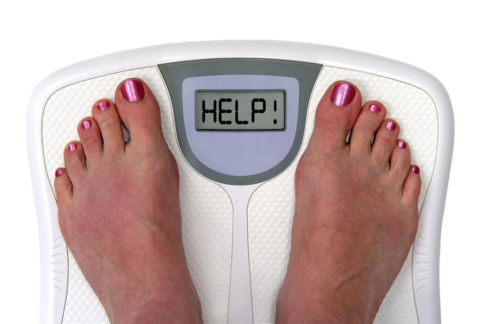 A pair of feet with polished toenails stands on a scale displaying the word "HELP!" humorously suggesting a weight dilemma.