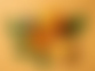 Orange Essential Oil bottle with full and halve piece of orange and green leaves surrounded.