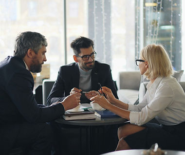 a group of people sitting around a table_edited.jpg