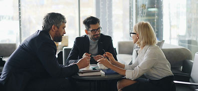 a group of people sitting around a table