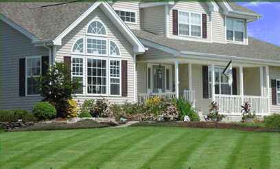 Beautifully landscaped home with attractive lawn. Let New Earth Landscaping landscape your home and provide lawn care