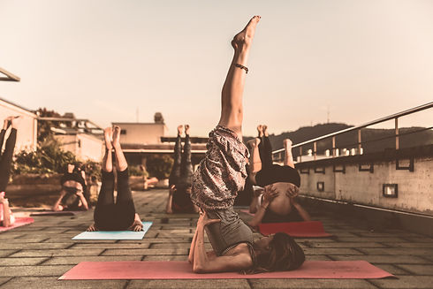 Canva - Group of Women Lying on Yoga Mat Under Blue Sky_edited.jpg