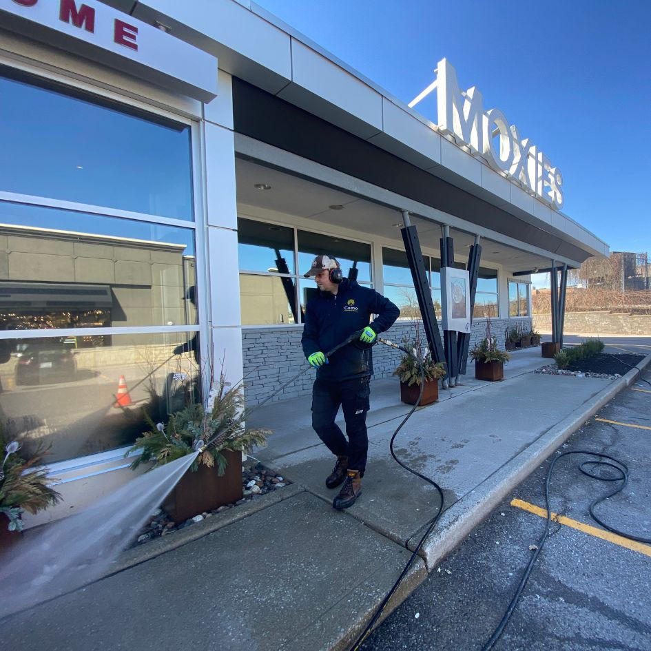 Close-up of pressure washing equipment in action