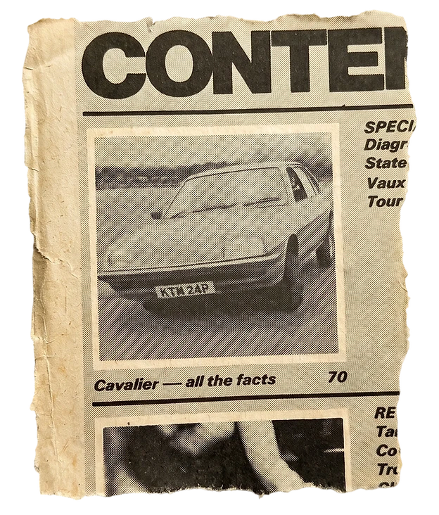 Macro photography of an old torn magazine clipping featuring a vintage Vauxhall Cavalier car. The paper has a distressed, aged texture on a black background.