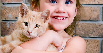 Girl Holding Kitten