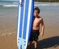 Child surfing indian ocean