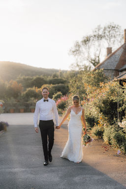 Romantic couple portraits at Upwaltham Barns, West Sussex, captured in a timeless rustic setting by Amy Diana Photography.