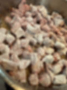 Wagyu stew meat dredged in flour for carne guisada