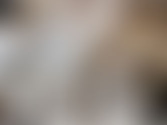 Table with vintage maps, open notebook, magnifying glass, and old photographs, evoking research for historical fiction.”