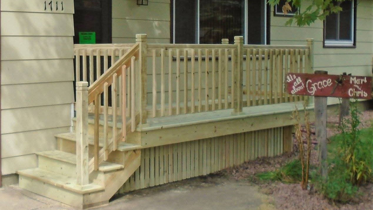 New steps and small porch on a ranch home.