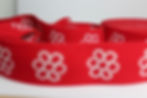 Rotes Gummiband Bailo mit weißen Blumenmustern