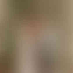 A bride and groom hold hands at the altar with their officiant.