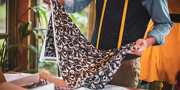 Silk scarf specialist inspecting a vintage silk scarf collection