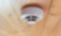 smoke-detector-wood-ceiling-closeup.jpg
