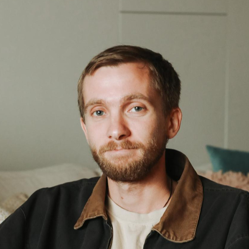 Man with beard looking at camera