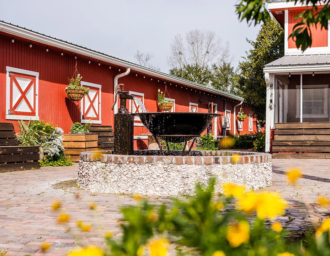 the brick courtyard with fire and water fountain at the traditional Barn at Red Gate Farms