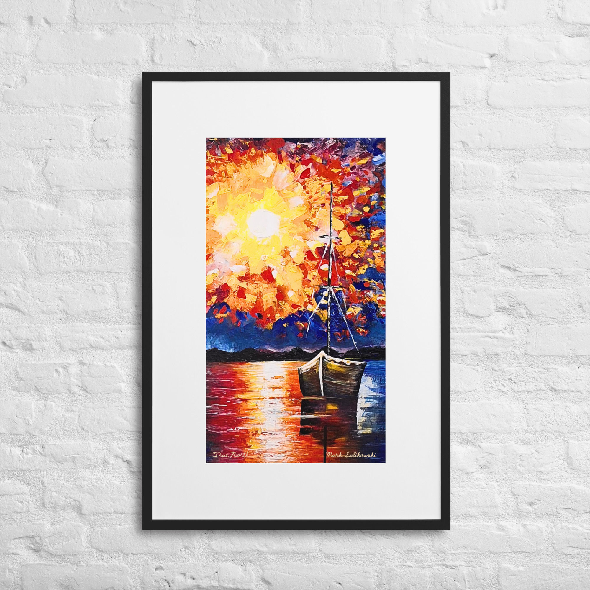 Black framed Print of True North of a sailboat at sunset. "True North" (2022) — Framed Print.
Discover the captivating contrast of serene stillness and vibrant energy in "True North", an original acrylic palette knife painting by artist Mark Sulikowski. Created in July 2022, this masterful canvas captures an exhilarating burst of colour erupting over a tranquil seaside. Anchoring the scene is a single boat, sitting quietly as a solitary witness to a spectacular, light-filled display. Bursts of yellows, oranges reds, whites and pinks fill the sky set against a dark blue background. The bottom part of the painting reflects the burst of yellows, reds and oranges. with a brown boat off to the right of the painting.