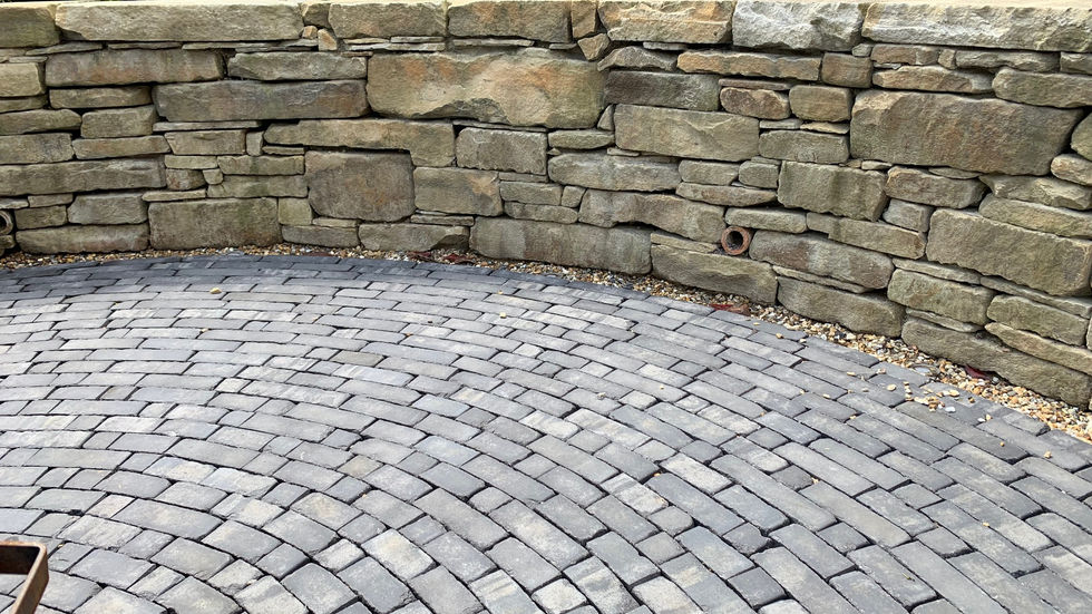Curved brickwork path and walls