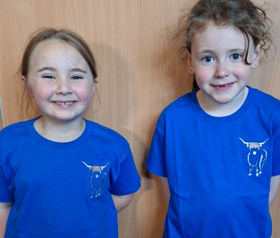 Young models wearing IsleEmbroider products