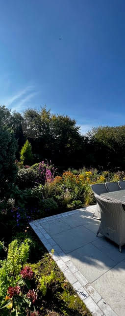 grey patio with glass topped garden table