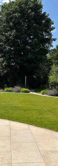 circular patio area with stone planter