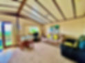 inside a lodge with table and sofa