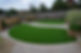 bespoke block paving area and circular artificial grass patches
