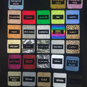 Grid of glitter, hologram, metallic, camo, glow, and reflective swatches printed on a black tee for custom screen printed t shirts. At Wow! Custom Tees