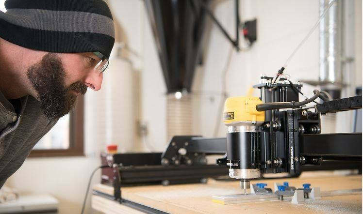 IDEA Lab member using the CNC Router