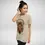 Thumbnail: Model wearing Sand unisex cat t-shirt with dreamcatcher cat design, relaxed everyday fit.