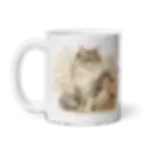 White ceramic mug shown from the left side with handle visible and floral long-haired cat illustration on the front
