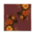Square burgundy pillow cover with mirrored black cats surrounded by orange and yellow flowers.