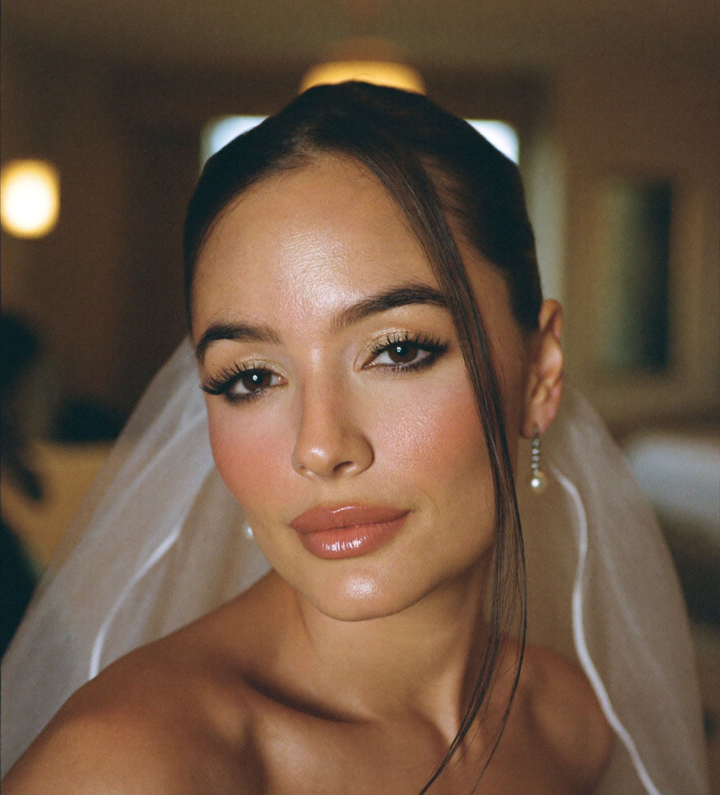 Close-up bridal portrait with soft glam makeup, glowing skin, and veil by My Inner Look in Las Vegas.