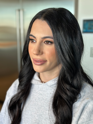 Natural glam with long dark waves and bronzed eyeshadow.