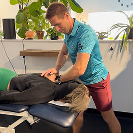 Physical therapist performing hands-on low back treatment at Chardon Performance Therapy