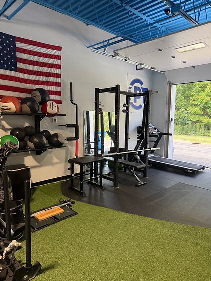 CPT clinic gym power racks and turf.jpeg