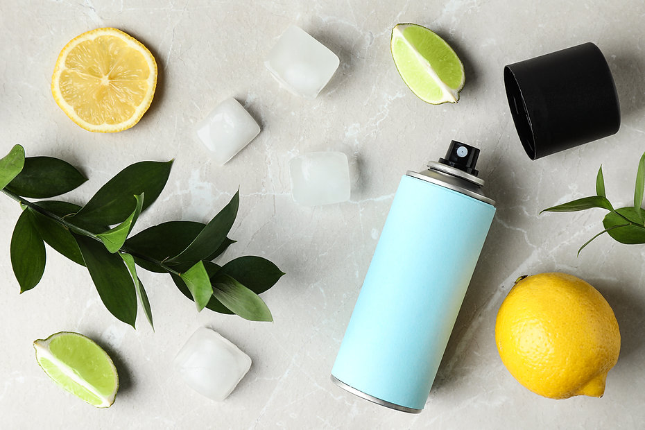 Flat lay composition with spray deodorant on light grey marble table.jpeg
