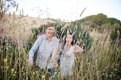 Lesbain couple parting and walking through the grasses by Julie Weisberg engagement photographer,Julie Weisberg engagement photographer,