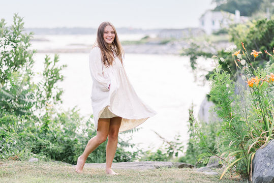 Tallulah in dress overlooking ocean