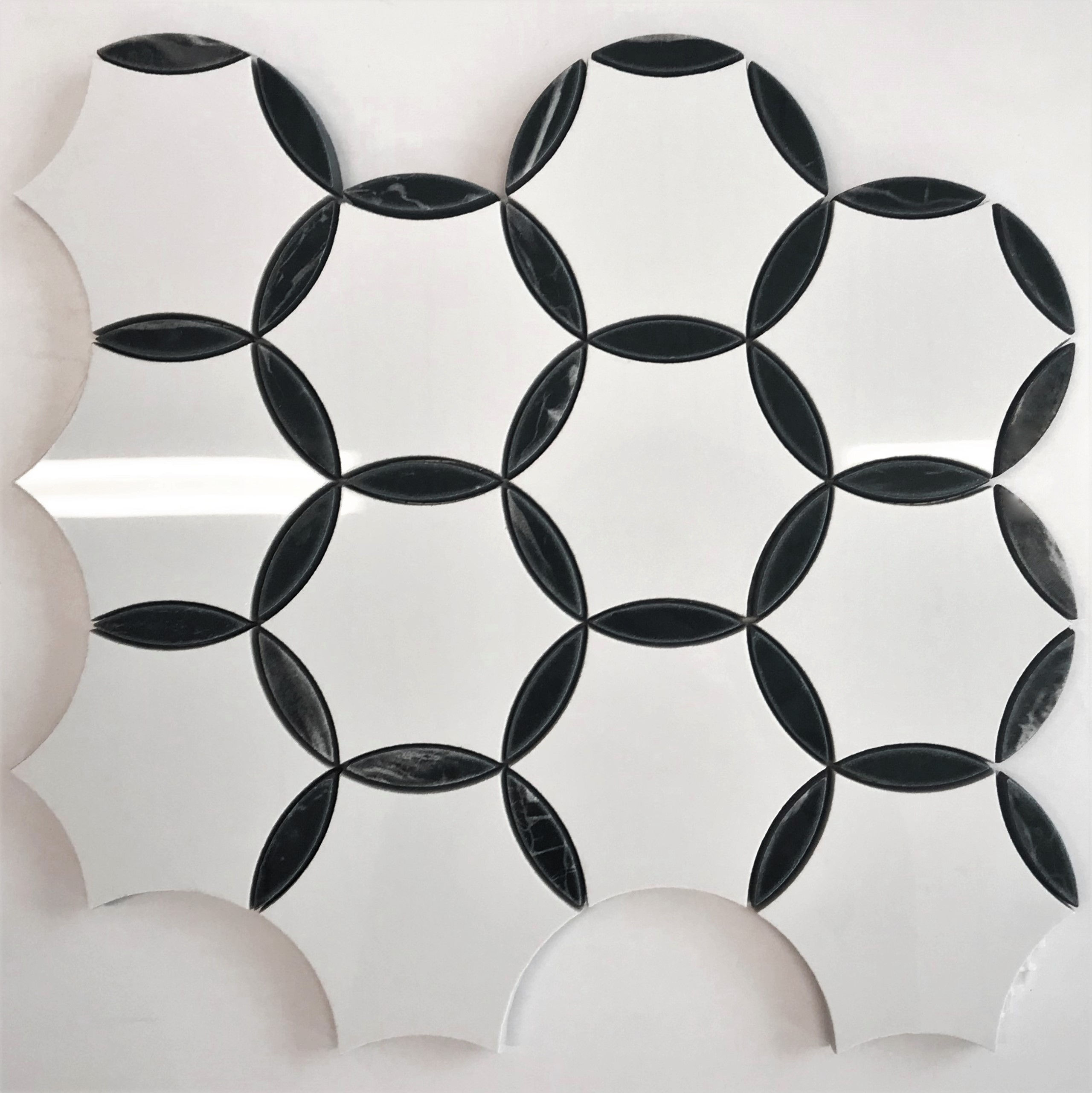 A pretty mosaic patterned porcelain tile in black and white classic yet trendy